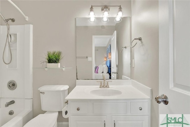 bathroom with vanity, toilet, and shower / washtub combination