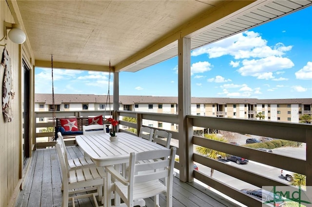 wooden terrace featuring a residential view