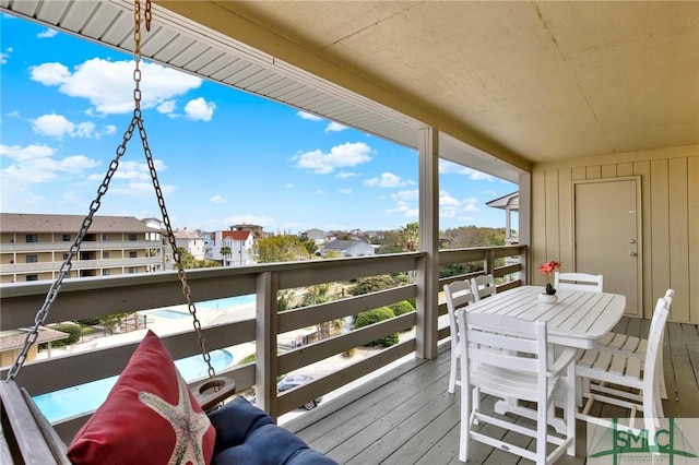 wooden deck with a residential view