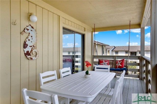 wooden deck featuring outdoor dining area