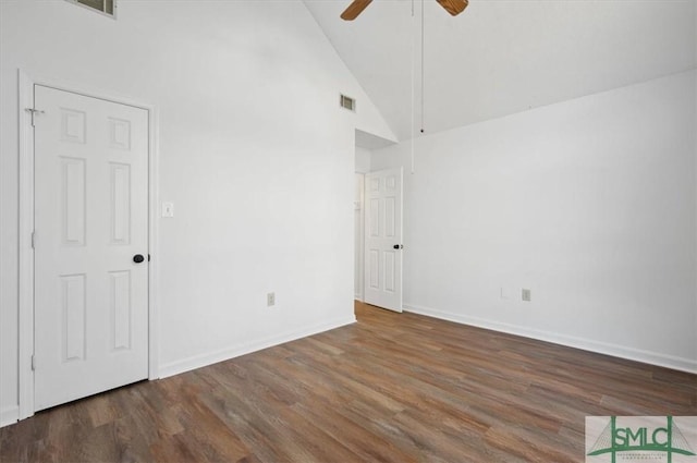 spare room with visible vents, wood finished floors, baseboards, and ceiling fan