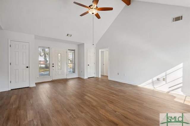 interior space featuring visible vents, beamed ceiling, wood finished floors, and a ceiling fan