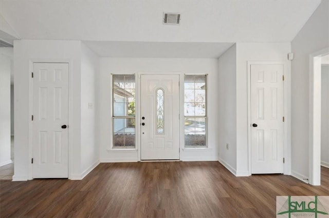 entrance foyer featuring visible vents, baseboards, and wood finished floors