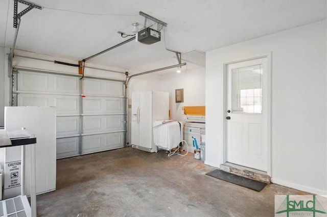 garage with electric panel, a garage door opener, and baseboards