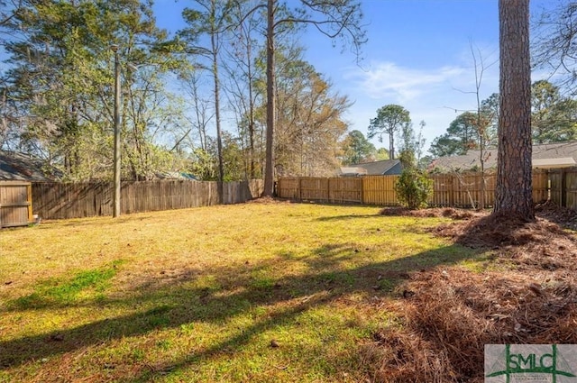 view of yard featuring a fenced backyard