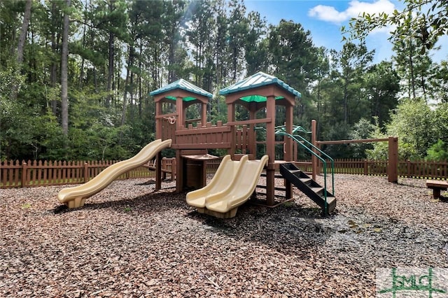 community jungle gym featuring fence