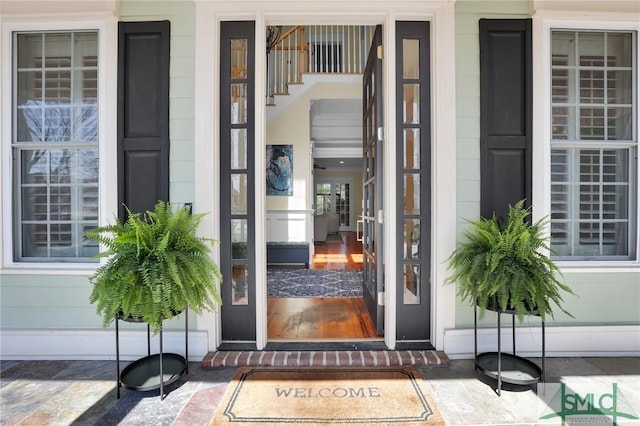 view of exterior entry with covered porch