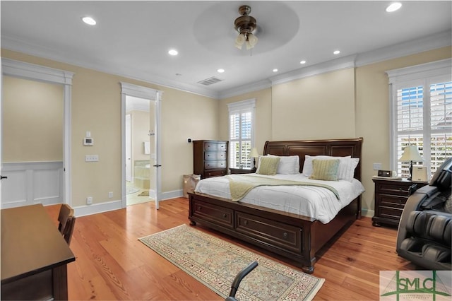 bedroom featuring crown molding, multiple windows, visible vents, and light wood finished floors