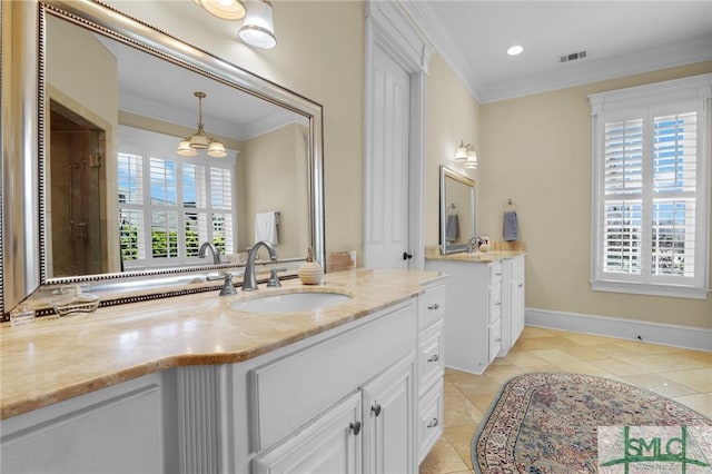 full bath featuring tile patterned flooring, crown molding, visible vents, and a sink