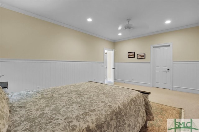 bedroom featuring recessed lighting, a wainscoted wall, and ornamental molding