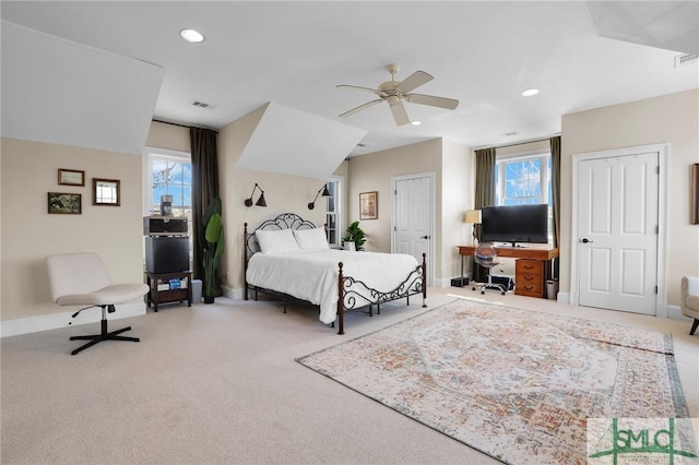 bedroom with recessed lighting, multiple windows, and carpet