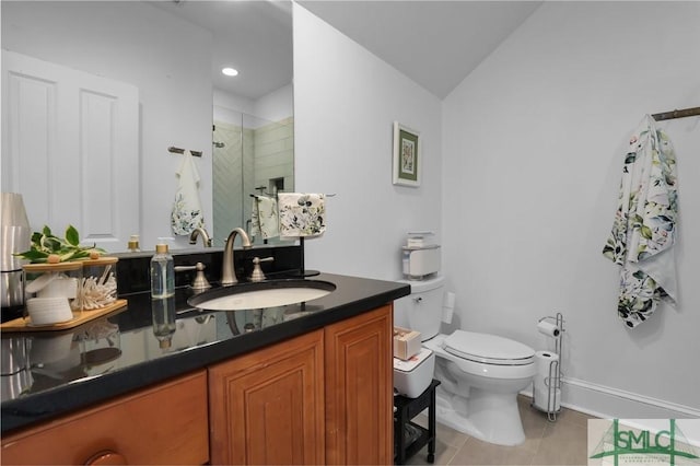 full bathroom with vanity, toilet, a shower stall, and tile patterned flooring