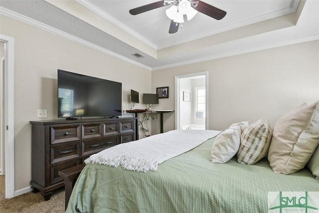 carpeted bedroom featuring visible vents, a raised ceiling, ceiling fan, and ornamental molding