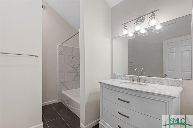 full bath featuring tile patterned floors, vanity, shower / bathing tub combination, and baseboards