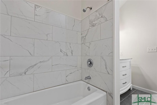 full bathroom with baseboards, vanity, and shower / bathtub combination