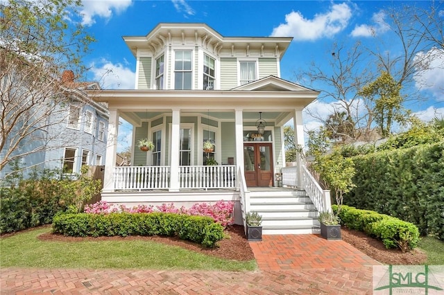 italianate home with french doors and covered porch