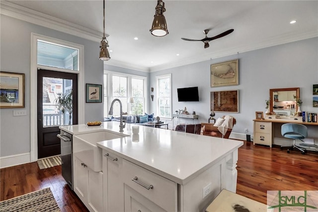 kitchen featuring crown molding, a ceiling fan, open floor plan, and light countertops