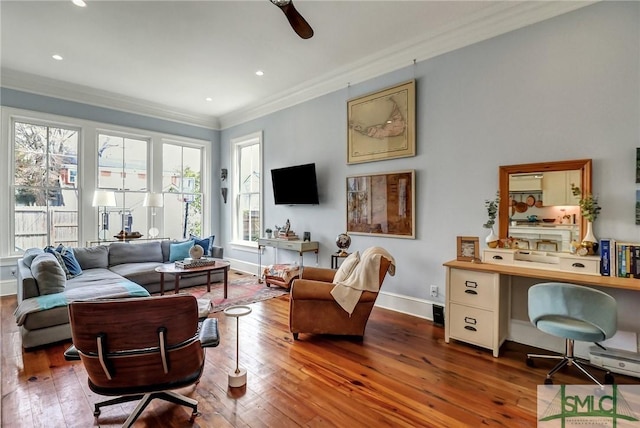 living room featuring hardwood / wood-style floors, crown molding, recessed lighting, and baseboards