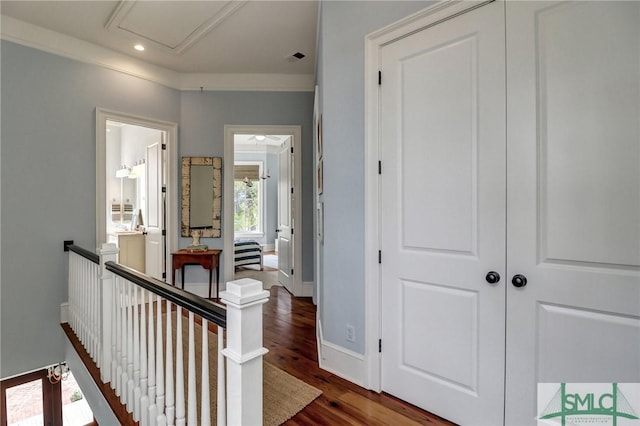 hallway with recessed lighting, baseboards, an upstairs landing, and wood finished floors