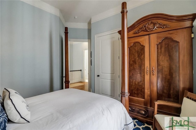 bedroom with crown molding