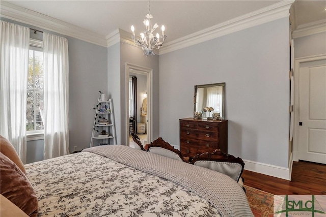 bedroom with baseboards, wood finished floors, an inviting chandelier, and ornamental molding