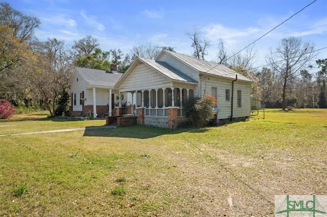 exterior space featuring a lawn and a porch