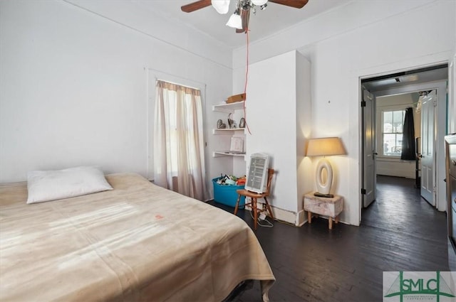 bedroom featuring ceiling fan and dark wood-style floors