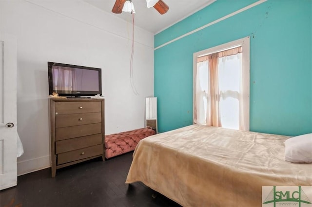 bedroom with dark wood finished floors and a ceiling fan