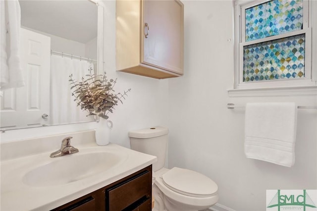 full bath with vanity and toilet