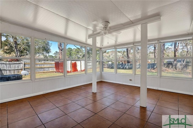 unfurnished sunroom featuring plenty of natural light and ceiling fan