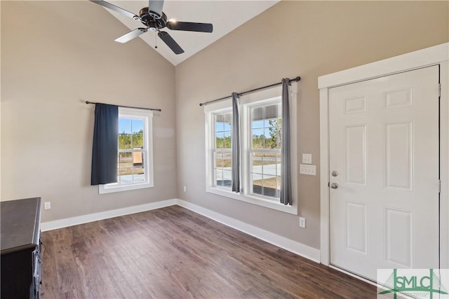 entrance foyer featuring dark wood finished floors, lofted ceiling, a ceiling fan, and baseboards