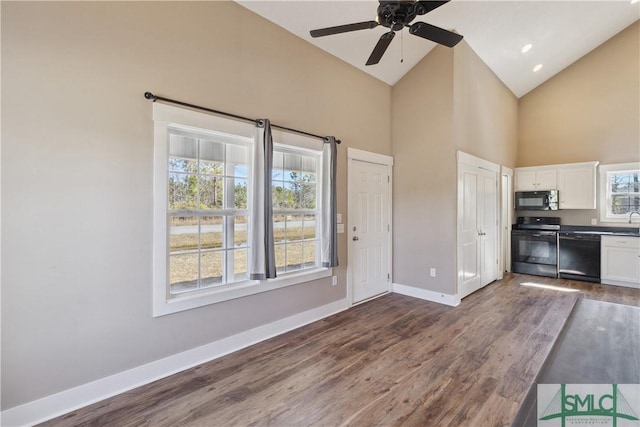 kitchen with black appliances, baseboards, dark wood-style floors, white cabinetry, and a ceiling fan