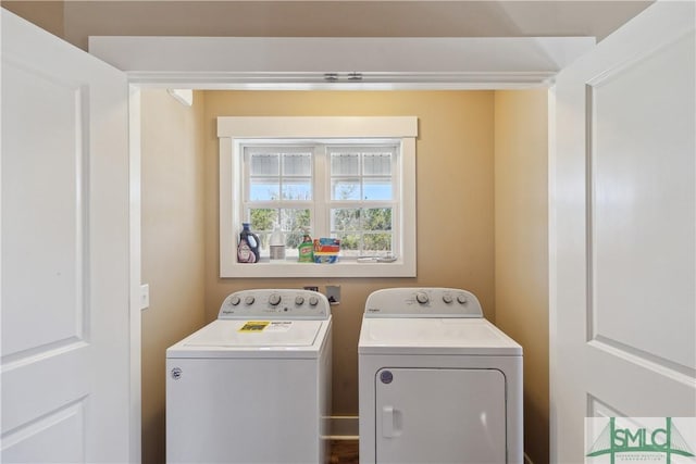 washroom featuring washer and dryer and laundry area