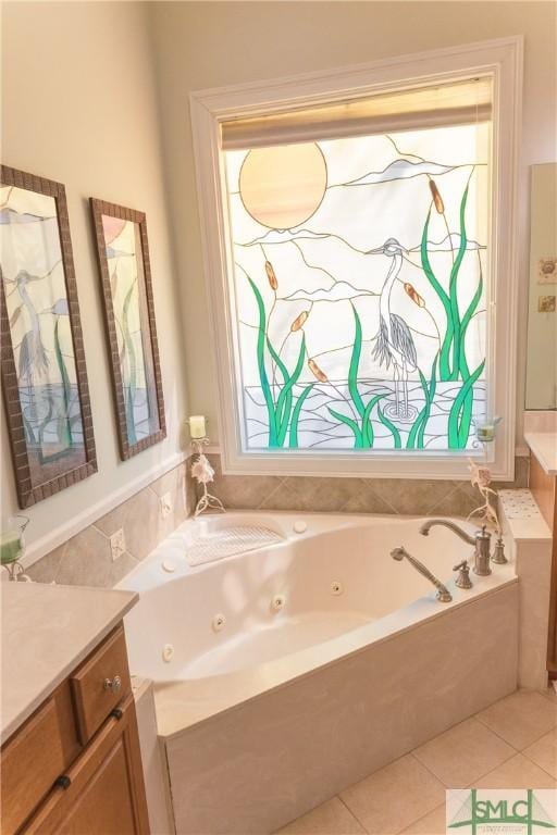 full bathroom with vanity, tile patterned floors, and a tub with jets