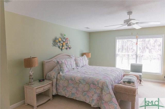 bedroom with baseboards, light colored carpet, and ceiling fan