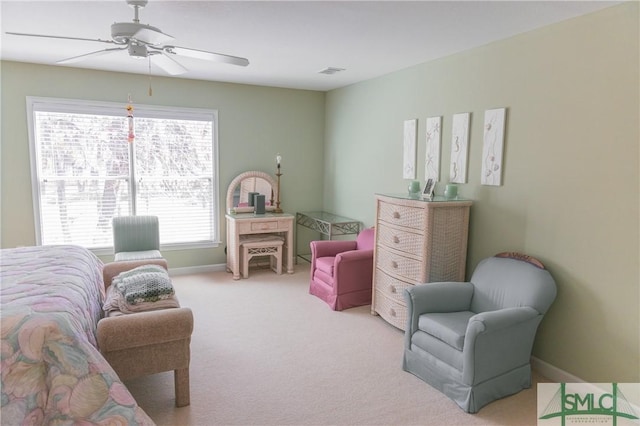 interior space with visible vents, baseboards, and a ceiling fan