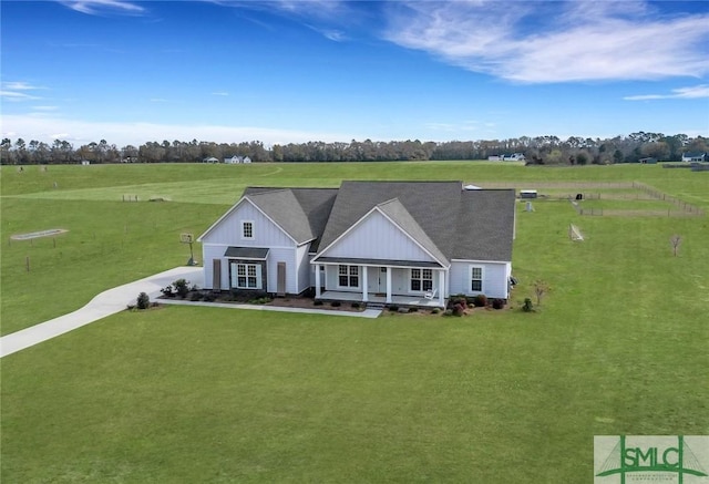 birds eye view of property featuring a rural view