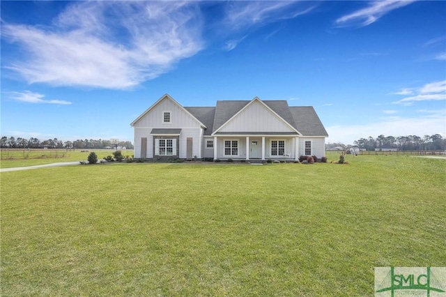 view of front of home featuring board and batten siding and a front yard