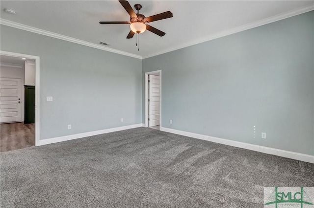 spare room featuring carpet flooring, baseboards, a ceiling fan, and ornamental molding