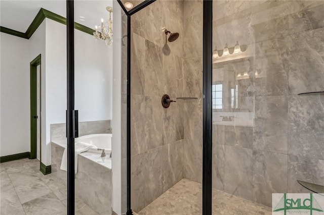 full bathroom featuring a garden tub, a stall shower, an inviting chandelier, crown molding, and baseboards