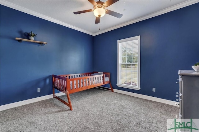 unfurnished bedroom with carpet flooring, ceiling fan, crown molding, and baseboards