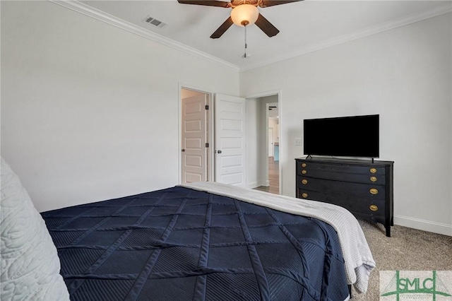 unfurnished bedroom featuring visible vents, ornamental molding, a ceiling fan, carpet floors, and baseboards