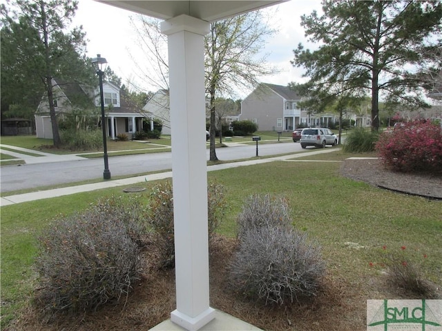 view of yard featuring a residential view
