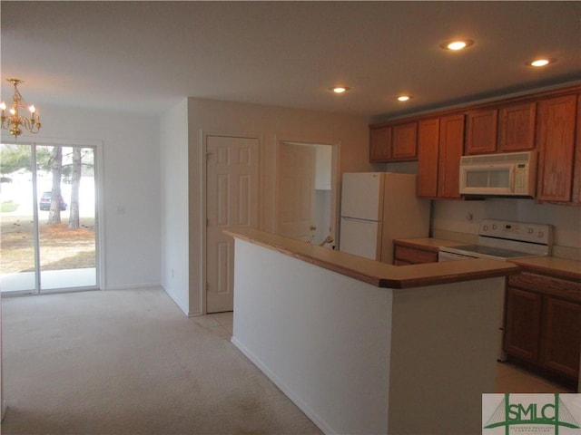 kitchen with recessed lighting, light carpet, brown cabinets, and white appliances