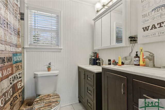 bathroom with toilet and vanity