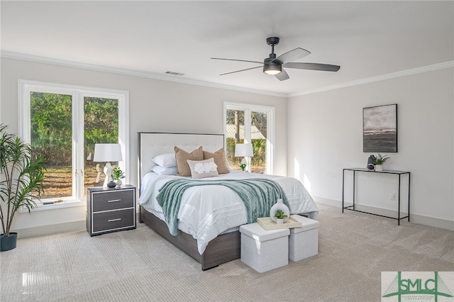 bedroom featuring visible vents, light carpet, multiple windows, and ornamental molding