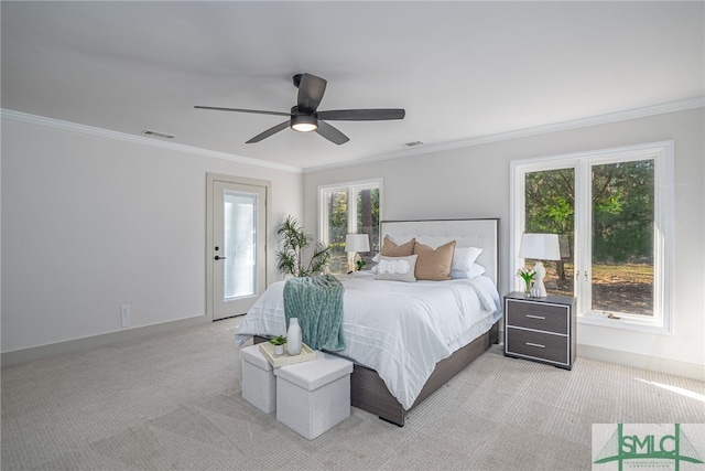 bedroom with visible vents, light colored carpet, and ornamental molding