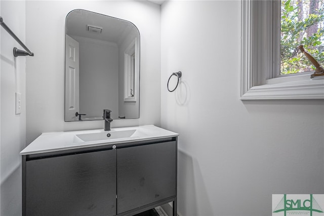 bathroom with visible vents and vanity