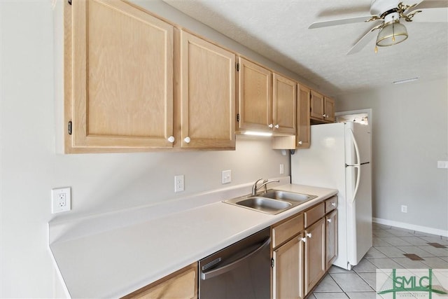 kitchen featuring light brown cabinets, a sink, light tile patterned floors, dishwasher, and ceiling fan