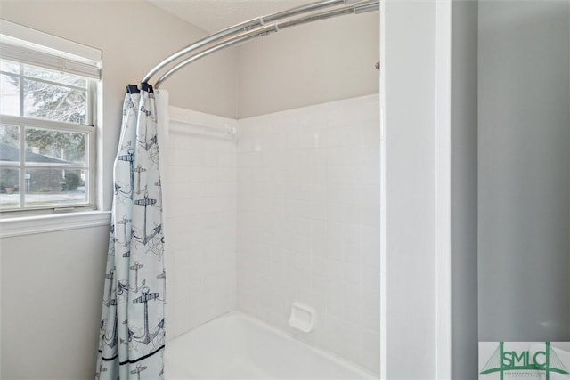 full bath featuring shower / tub combo with curtain